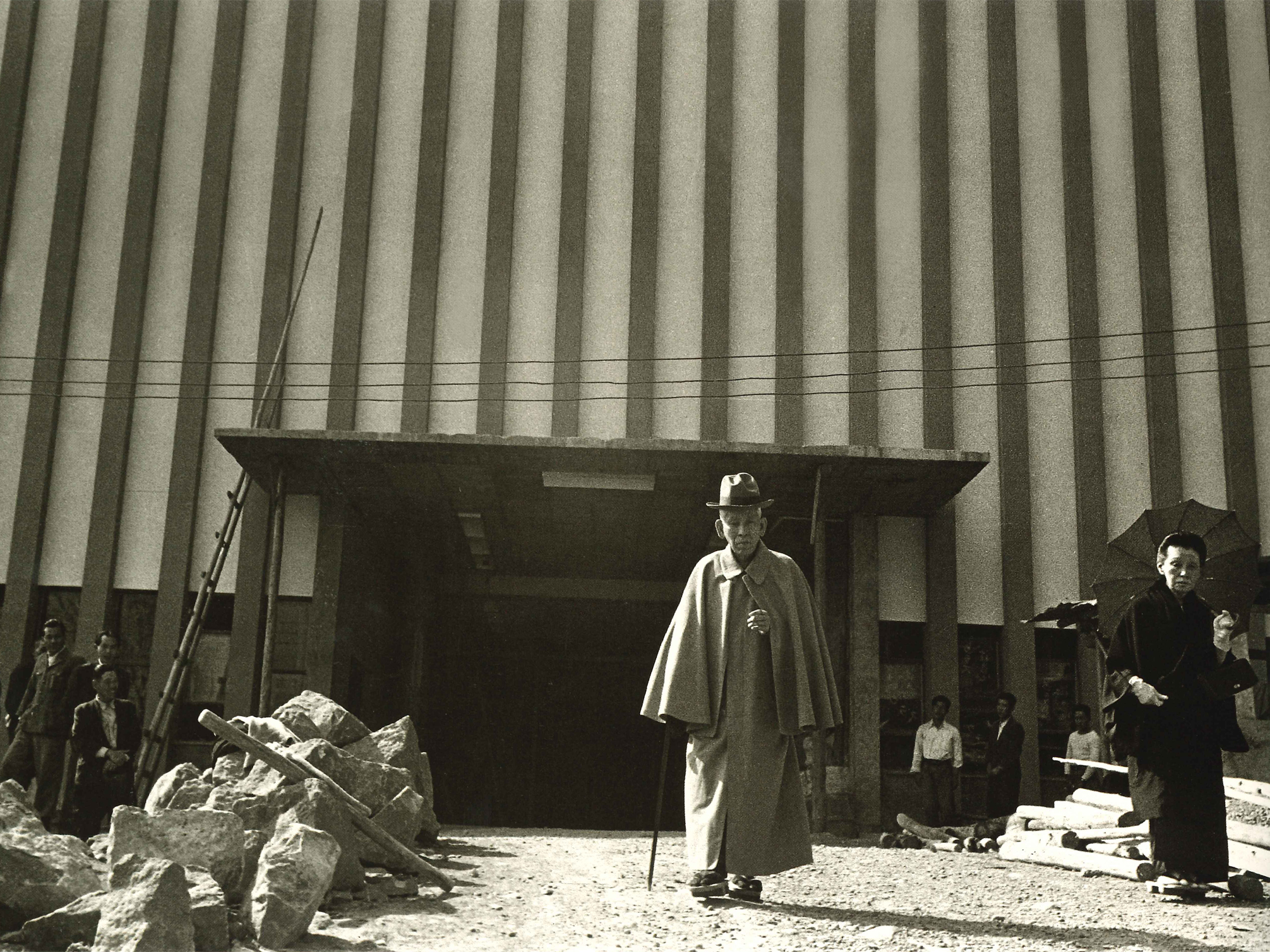 Okada in front of the old Meshiya Kaikan (April 3, 1954)